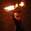 Fire dancer spinning torches at Wailea Luau in Maui.